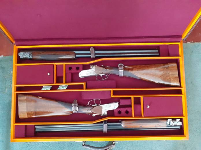 A pair of MTs-7 shotguns in a case